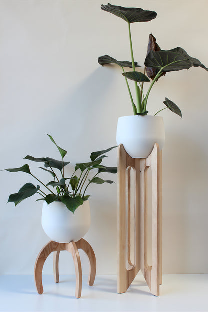 modern tall wood plant stand and small nested wood plant stand with pots