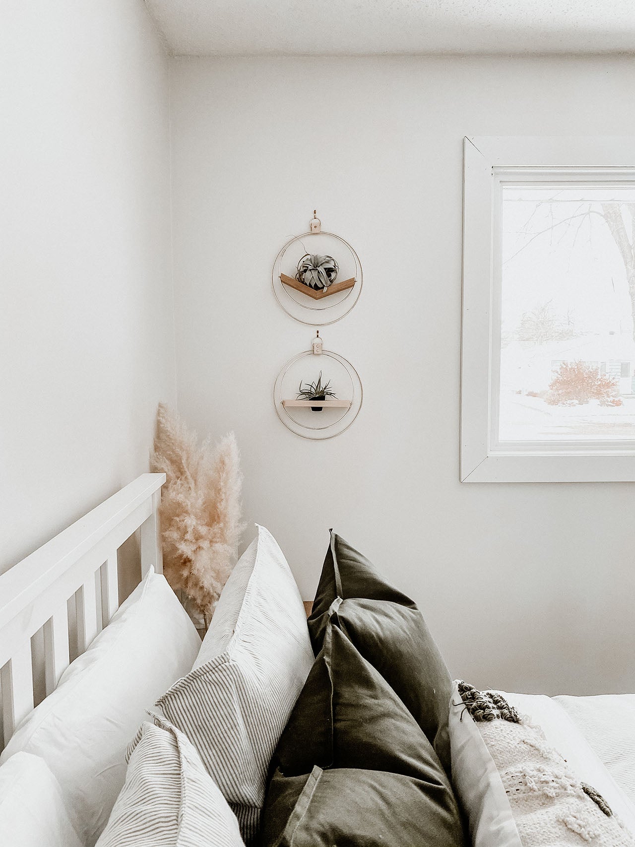 wall mounted plant shelves from Kandis Cottage styled on white wall in bedroom