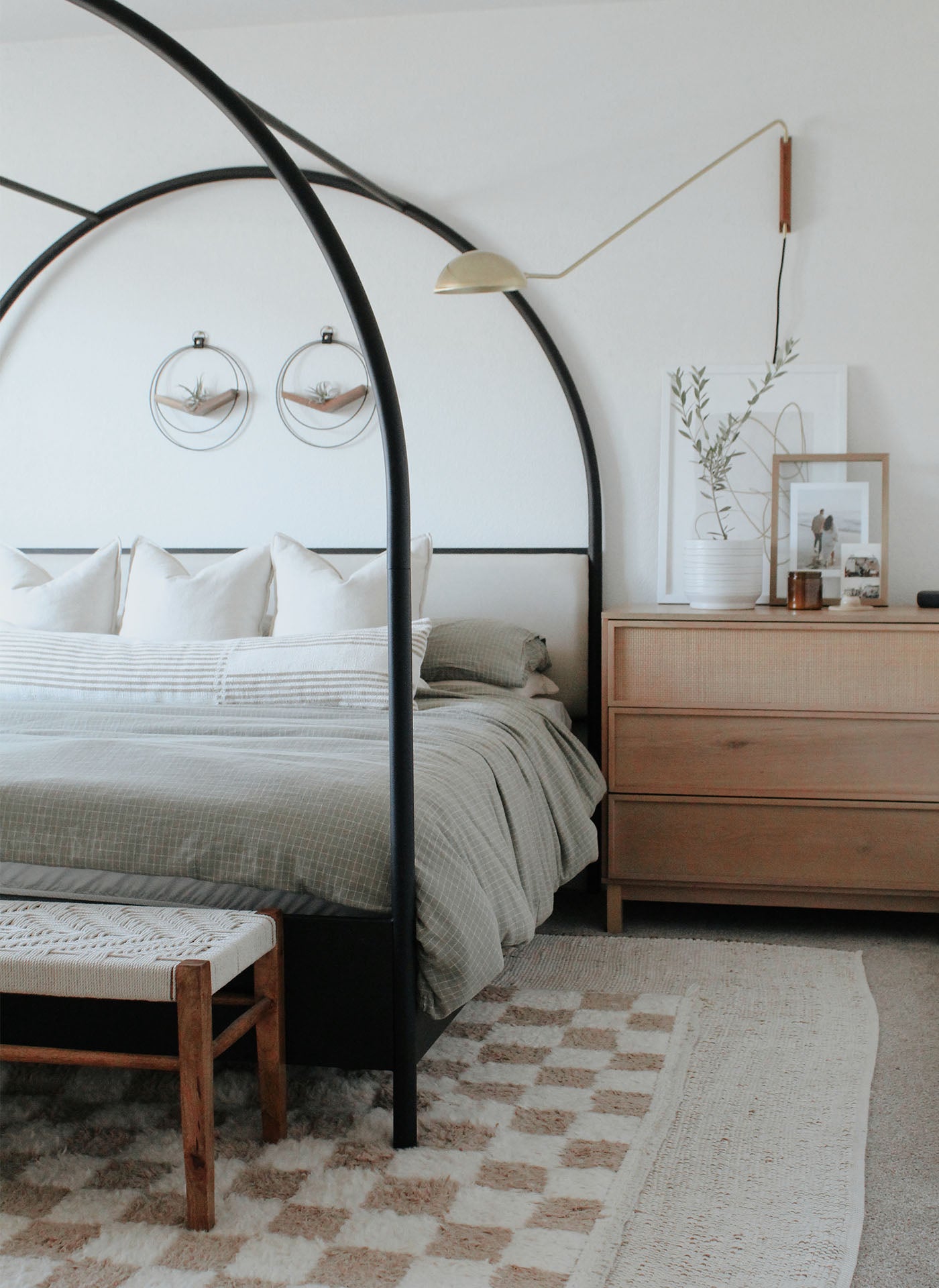modern bedroom with Kandis Cottage plant hangers in black and walnut styled above bed