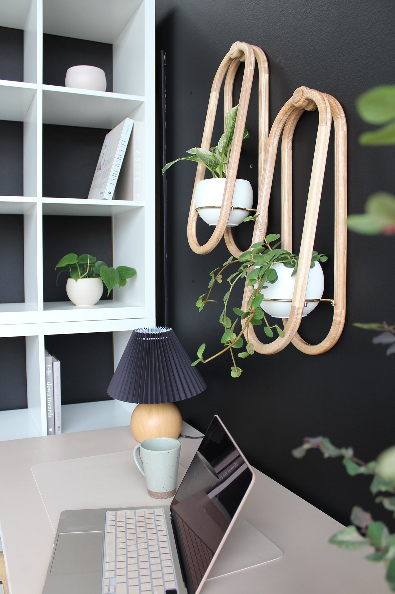 moody home office with black accent wall, styled with frame wall planters by Kandis Cottage