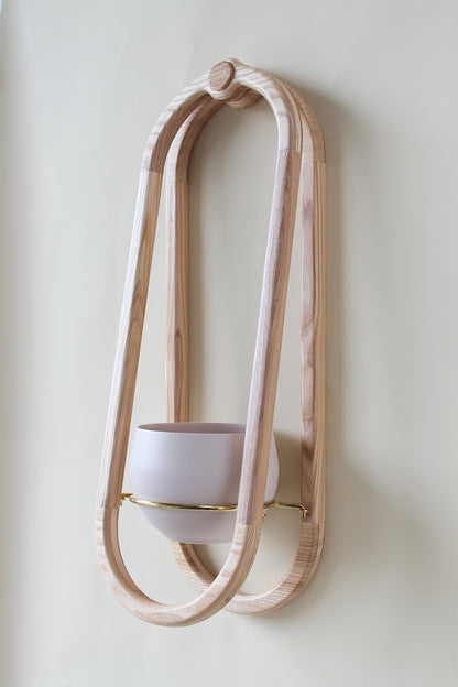 modern scandi inspired obround wall mounted planter with blush colored pot 