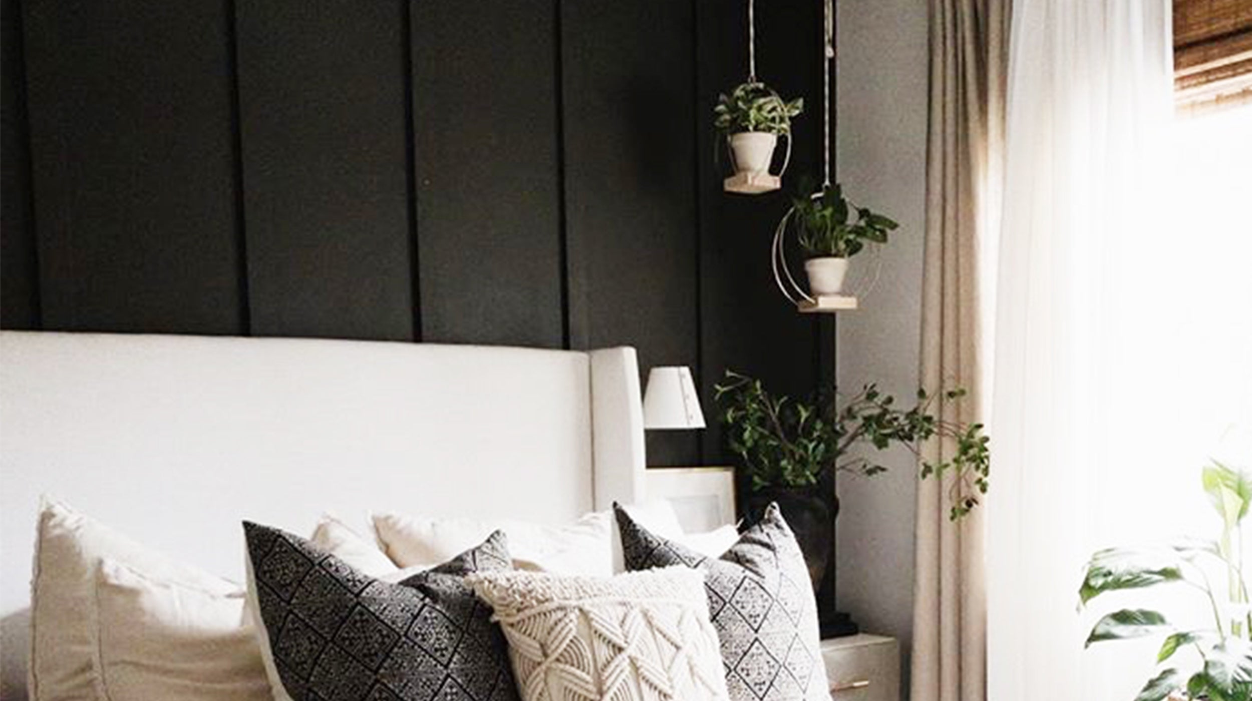 two gold metal circular plant hangers in a bedroom