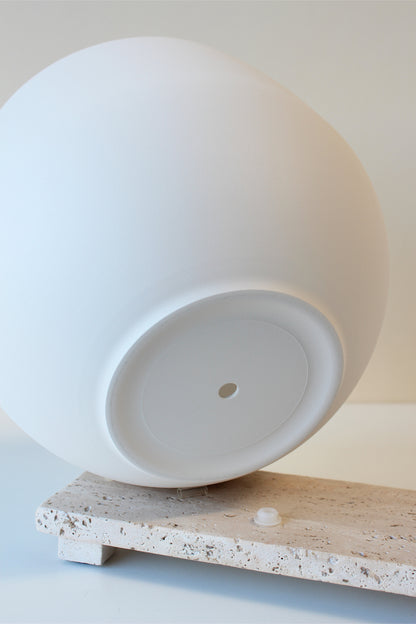 large white pot with drainage hole and plug