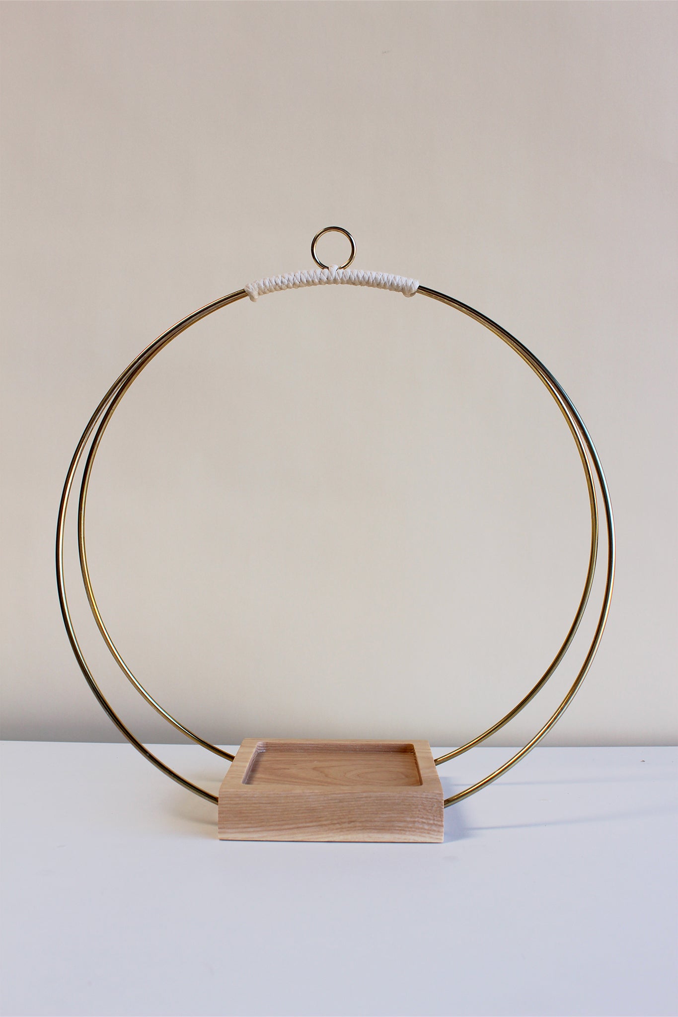large gold circular plant hanger without pot